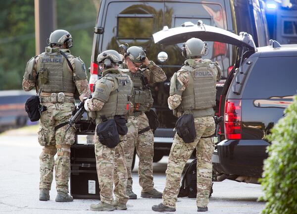 DeKalb County police SWAT members suit up  to help with a bomb threat Thursday morning.