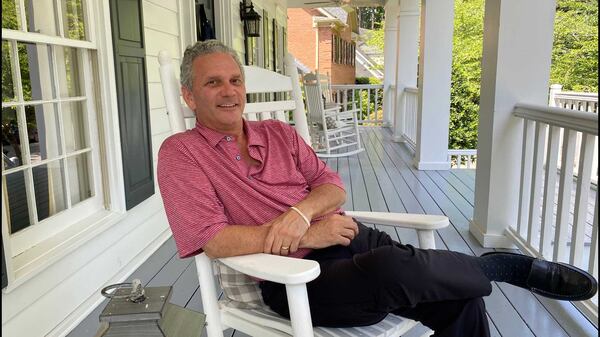 Henry W. Grady III, great-great-grandson of late 19th-century Atlanta Constitution editor Henry Grady, sits on the front porch of his northwest Atlanta home. (Eric Stirgus/estirgus@ajc.com)