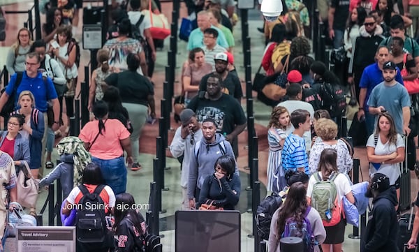 As many as 300,000 are expected to hit Atlanta streets both Saturday and Sunday as part of a variety of celebrations, gatherings and games. By Monday, as many as 700,000 will have visited, making it the busiest holiday weekend of the year for the Atlanta Police Department. JOHN SPINK / JSPINK@AJC.COM