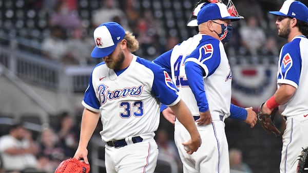 Braves relief pitcher A.J. Minter (33) is relieved in the eighth inning after issuing three walks Monday, April 12, 2021, against the Miami Marlins at Truist Park in Atlanta. The Marlins won 5-3 in an extra inning. (Hyosub Shin / Hyosub.Shin@ajc.com)