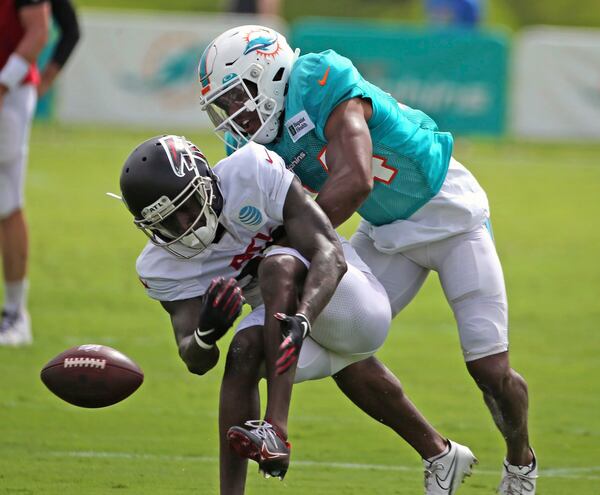 Dolphins cornerback Byron Jones (rear) and Falcons wide receiver Juwan Green run a drill during a joint training camp practice at the Dolphins training facility Wednesday, Aug. 18, 2021, in Miami Gardens, Fla.  (Charles Trainor Jr./Miami Herald)