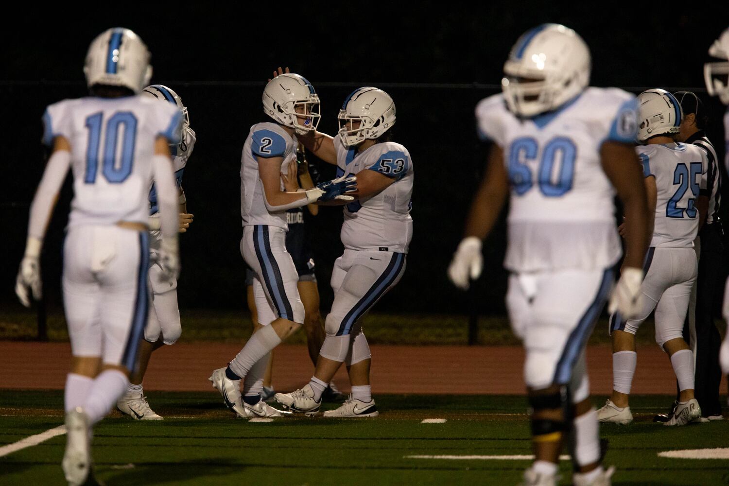 Cambridge players celebrate a touchdown during a GHSA high school football game between Cambridge High School and Johns Creek High School in Johns Creek, Ga. on Friday, October 15, 2021. (Photo/Jenn Finch)