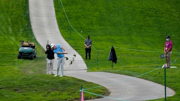 Viktor Hovland, of Norway, hits from next to a cart path to the 13th fairway on the South Course during the final round of the Farmers Insurance Open Sunday, Jan. 30, 2021, at Torrey Pines in San Diego. (Gregory Bull/AP)