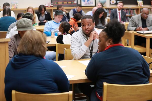 Parents and other attendees participate in round table discussion during the Atlanta Public Schools presentation on an improvement plan during a community meeting at Hope-Hill Elementary School on Monday, Feb. 25, 2019.    Curtis Compton/ccompton@ajc.com