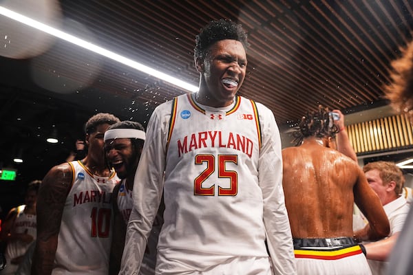 Maryland center Derik Queen celebrates with teammates after making the winning basket for a 72-71 win over Colorado State in the second round of the NCAA college basketball tournament Sunday, March 23, 2025, in Seattle. (AP Photo/Lindsey Wasson)