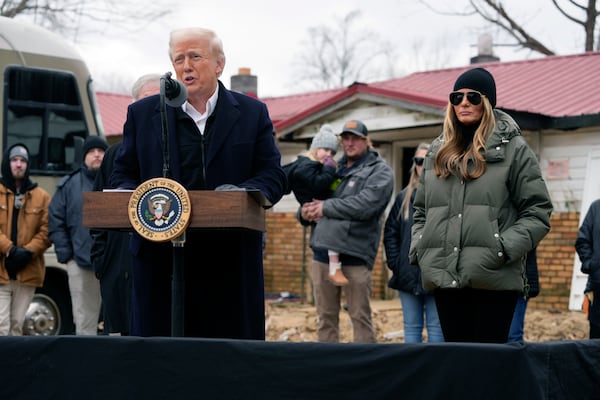 President Donald Trump speaks along side first lady Melania Trump, as they meet with homeowners affected by Hurricane Helene in Swannanoa, N.C., Friday, Jan. 24, 2025. (AP Photo/Mark Schiefelbein)