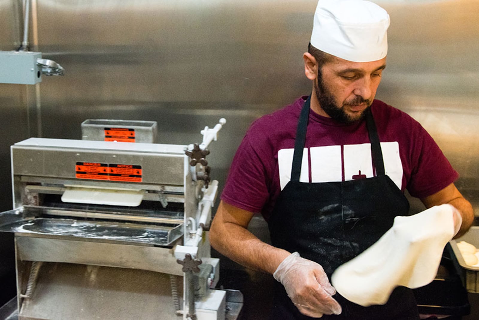 Ismail Alismael making fresh saj bread, similar to Levantine markook. CONTRIBUTED BY HENRI HOLLIS