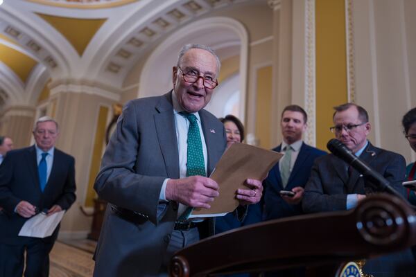 Senate Minority Leader Chuck Schumer, D-N.Y., arrives to speak with reporters as Republicans work to pass an interim spending bill that would avoid a partial government shutdown and keep federal agencies funded through September, at the Capitol in Washington, Tuesday, March 11, 2025. (AP Photo/J. Scott Applewhite)