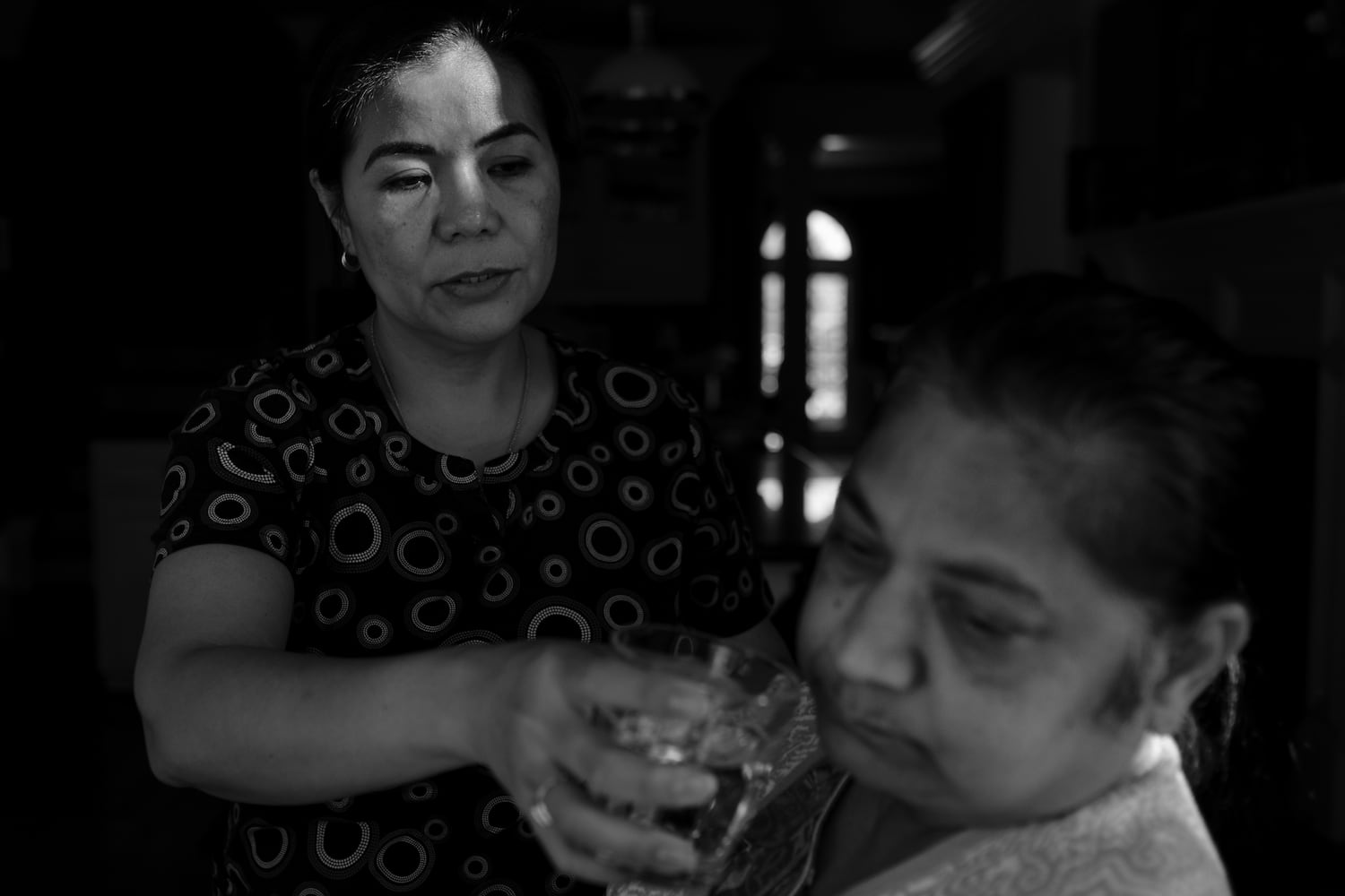 (L-R) Juliet Pingul spent four years caring for Rekha Shah, 65, who has frontotemporal dementia (FTD). The disease typically affects people in their 40s to 60s. This photo was taken in 2021 and published in 2022. (Arvin Temkar / arvin.temkar@ajc.com)