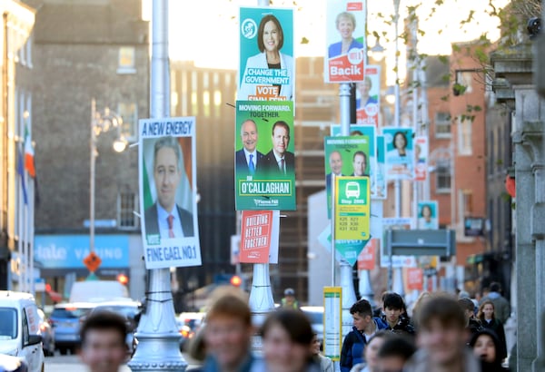 Irish election posters hang from lampposts in Dublin City centre, Tuesday, Nov. 26, 2024, ahead of Ireland's election on Friday. (AP Photo/Peter Morrison)