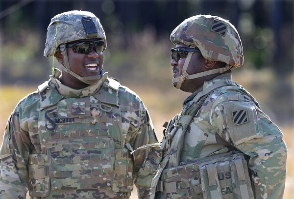 Fraternal twins Matthew, left, and Ryan McBride of Statesboro trained recently at Fort Stewart for a nine-month deployment to Afghanistan. “We are super close,” Matthew, a sergeant in the Guard and a Bulloch County sheriff’s deputy, said of his brother, Ryan. “That is my best friend right there, for sure.” Curtis Compton/ccompton@ajc.com