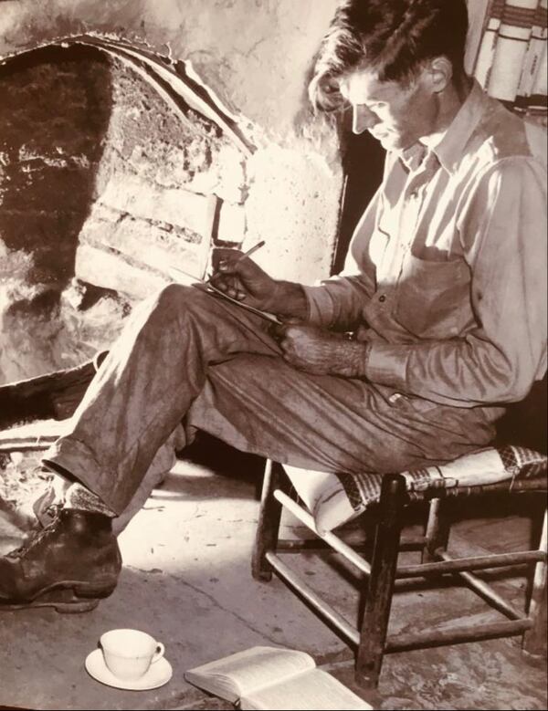 Byron Herbert Reece scribbles verse by his hearth in Choestoe.
Courtesy of Bob Reece