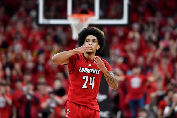 Louisville guard Chucky Hepburn (24) blows kisses to the crowd after being taken out of the game in the second half of an NCAA college basketball game against Stanford in Louisville, Ky., Saturday, March 8, 2025. (AP Photo/Timothy D. Easley)