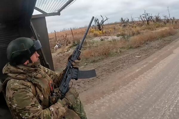 In this photo taken from a video released by Russian Defense Ministry Press Service on Friday, Nov. 22, 2024, a Russian engineer troops serviceman operates at an undisclosed location in Ukraine. (Russian Defense Ministry Press Service via AP)