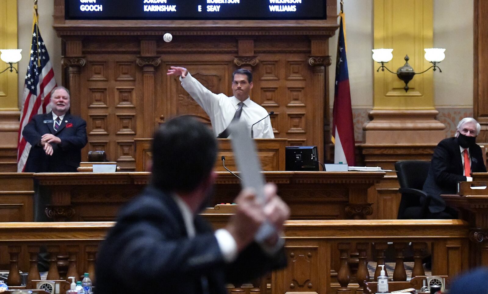 Then Lt. Gov. Geoff Duncan, a former pitcher at Georgia Tech, throws a baseball to another Georgia Tech pitcher, Hugh Chapman, on the last day of the legislative session in June 2020. (Hyosub Shin / Hyosub.Shin@ajc.com)