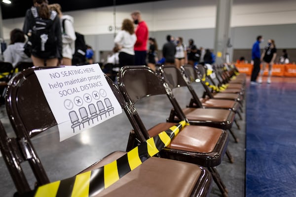 Coronavirus precautions at the Lil’ Big South volleyball tournament at the Georgia World Congress Center last month included blocked seats at courtside. (Ben Gray for The Atlanta Journal-Constitution)