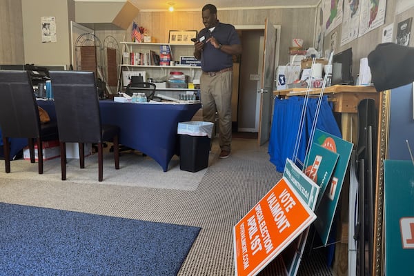 Escambia County Democratic Party Chair Derrick Scott works at the party's office in Pensacola, Fla. on March 18, 2025. (AP Photo/Kate Payne)