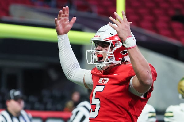 Milton quarterback Luke Nickel celebrates after his team scored in this month's state title game.
