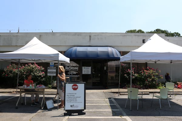 NETWorks Cooperative Ministry in downtown Tucker, provided emergency food assistance to local families three days per week throughout the pandemic. To prevent the spread of COVID-19, people checked in at a tent outside while volunteers filled a shopping cart with bags of non-perishable items and produce, when available. (William Newlin/UGA)