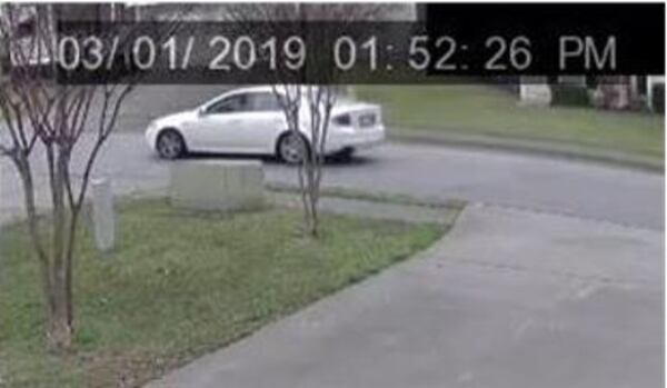 Investigators have released surveillance footage of a white Acura spotted leaving the scene of a fatal Lawrenceville shooting Friday afternoon.