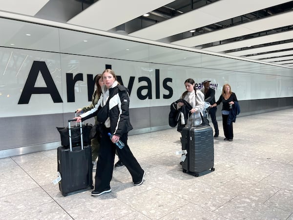 Passengers in the arrivals hall at Heathrow Terminal 5 in London, Saturday March 22, 2025, after flights resumed at the airport. (Maja Smiejkowska/PA via AP)