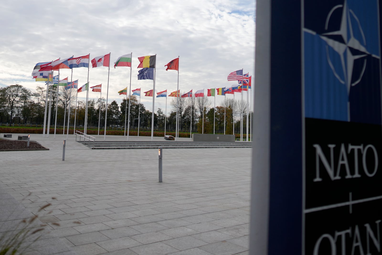 A view of flags of NATO member countries, outside NATO headquarters in Brussels on Monday, Oct. 28, 2024. (AP Photo/Virginia Mayo)