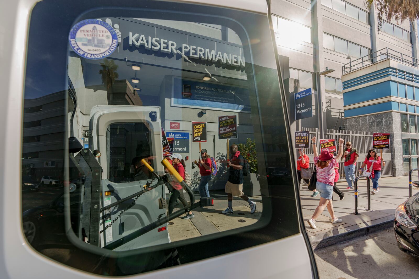 Mental health workers rally outside a Kaiser Permanente facility in Los Angeles Monday, Oct. 21, 2024. (AP Photo/Damian Dovarganes)