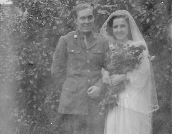 Mollie Parry didn’t wear her wedding gown during the ceremony, but she did put it on when she posed with her new husband, Staff Sgt. Bill King, afterward. (Courtesy of the Parry family)