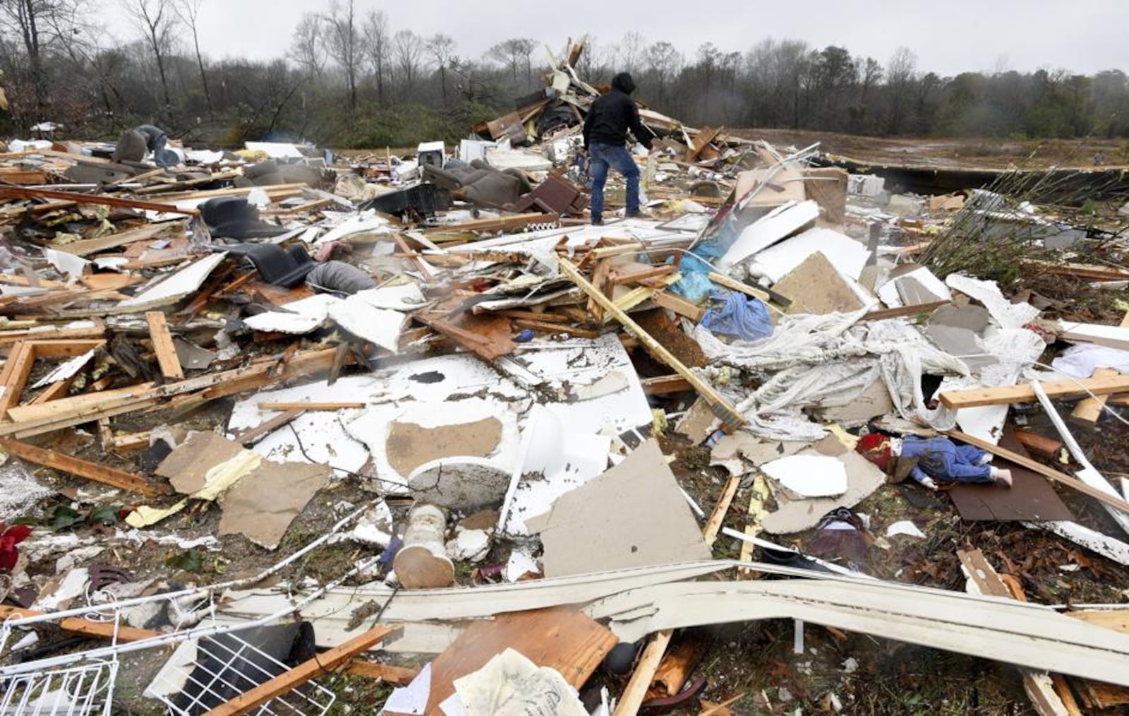 The bodies of an elderly couple were found Saturday near their demolished trailer by firefighters in Louisiana. A search for more possible victims was underway.