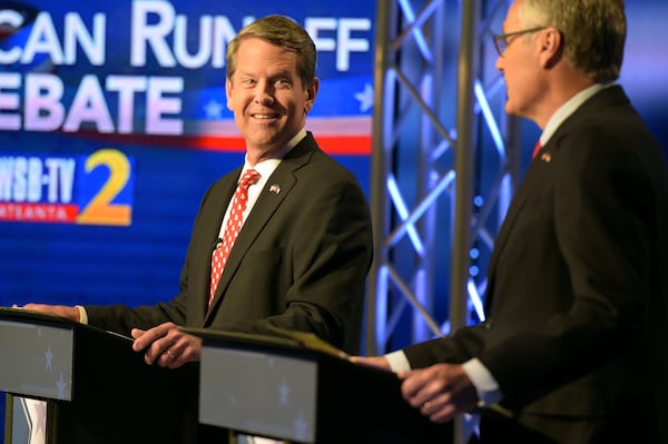 7/15/18 - Atlanta - Secretary of State Brian Kemp, left, smiles at Lt. Gov. Casey Cagle during the second and final televised debate at a Channel 2 Action News studio on Sunday, July 15. The runoff to decide the Republican candidate for governor will be held July 24. Jenna Eason / Jenna.Eason@coxinc.com