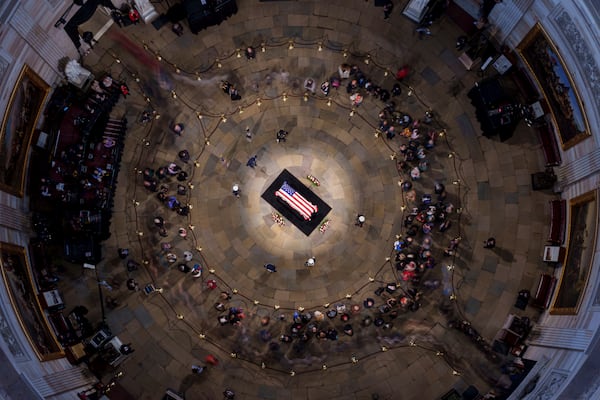 The flag-draped casket of former President Jimmy Carter lies in state at the rotunda of the U.S. Capitol, Wednesday, Jan. 8, 2025, in Washington. (Andrew Harnik/Pool via AP)