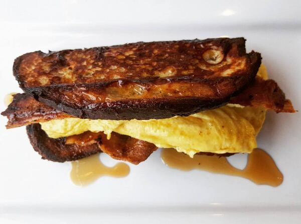 Breakfast is served: French toast taco with brioche, egg, bacon, and maple syrup at Dankbaar. / Facebook