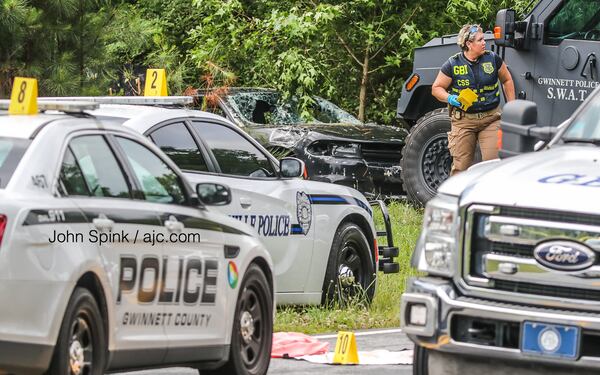 Officers with Gwinnett County police, Snellville police and GBI agents investigated the officer-involved shooting Friday morning.