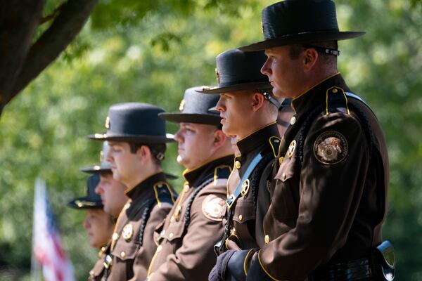 Members of the Paulding County Sheriff’s Office line up before firing a salute during the funeral for Deputy Brandon Cunningham in Dallas on Friday. (Ben Gray / Ben@BenGray.com)