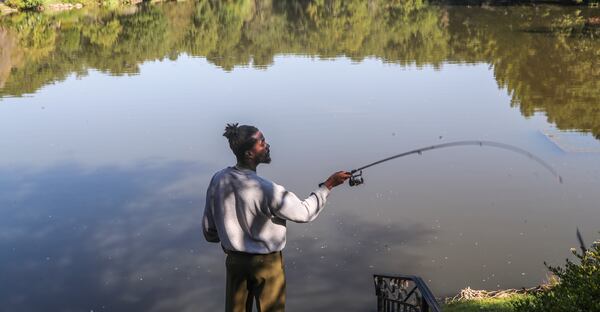 September 14, 2021 Dekalb County: Getting in one last dry day of fishing, Sherrod Bolden casts out onto Lake Avondale in the City of Avondale Estates in DeKalb County  on Tuesday, Sept. 14, 2021. Bolden tries to hit the lake as often as he can before working from home. Using artificial bait he favors looking for largemouth bass in the lake. Tropical Storm Nicholas made landfall along the Texas coast Tuesday morning as a Category 1 hurricane and is expected to bring showers to Georgia as early as Wednesday afternoon. Channel 2 Action News meteorologist Brian Monahan said with 14 named storms so far this hurricane season, 2021 is well above average but still below the pace of last year’s record season. “We’re starting to see some more showers here in North Georgia as we move through Wednesday afternoon,” Monahan said. “But by Thursday and Friday that tropical moisture moves in our direction with some better chances for rain. Not a washout, but it will be wet at times.” On Tuesday morning, it is warm but dry at the bus stops for kids headed off to school. Temperatures are in the low 70s across the city, according to Channel 2. Monahan said bus stops should be dry on the way home, too. “Most of us will be dry through the afternoon,” he said. “A little cooler with some more clouds for this afternoon.” Wednesday’s projected high is 81, and highs in the low 80s are in the forecast through Friday. (John Spink / John.Spink@ajc.com)