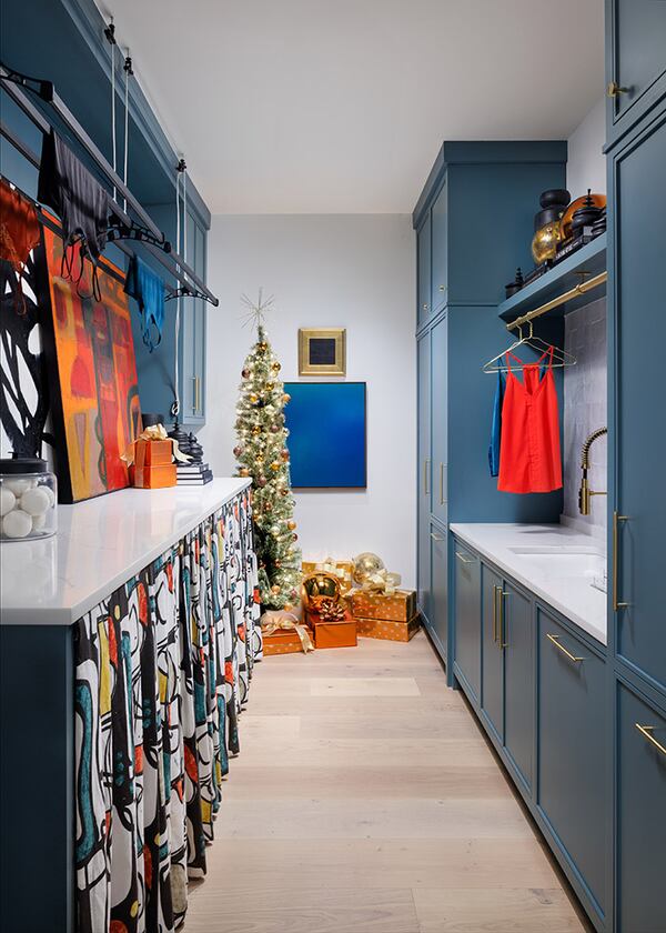 A cohesive color scheme is key for holiday decor says Bellwether Design and Interiors' Eryn Houck who leaned into shiny coppers and golds in this laundry room.
(Courtesy of Lauren Chambers)