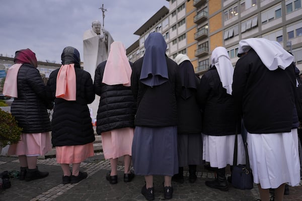 Nuns pray for Pope Francis in front of the Agostino Gemelli Polyclinic, where the Pontiff has been hospitalized since Feb.14, in Rome, Saturday, March 1, 2025. (AP Photo/Kirsty Wigglesworth)