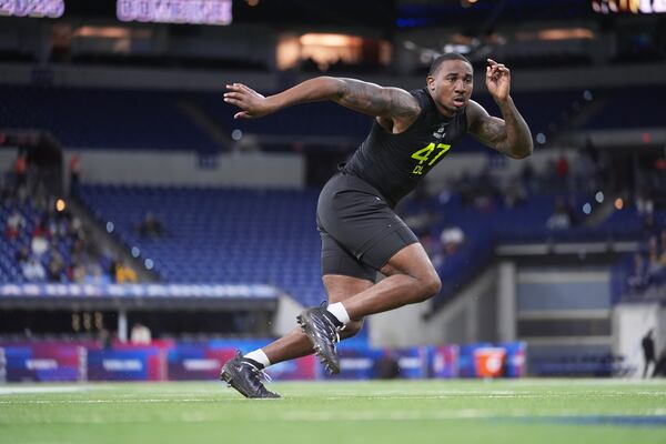 Boston College defensive lineman Donovan Ezeiruaku runs a drill at the NFL football scouting combine in Indianapolis, Thursday, Feb. 27, 2025. (AP Photo/Michael Conroy)