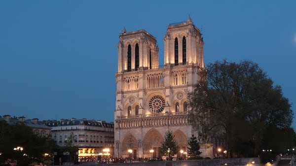 The Notre Dame Cathedral is seen by the Seine River on April 9, 2017 in Paris.