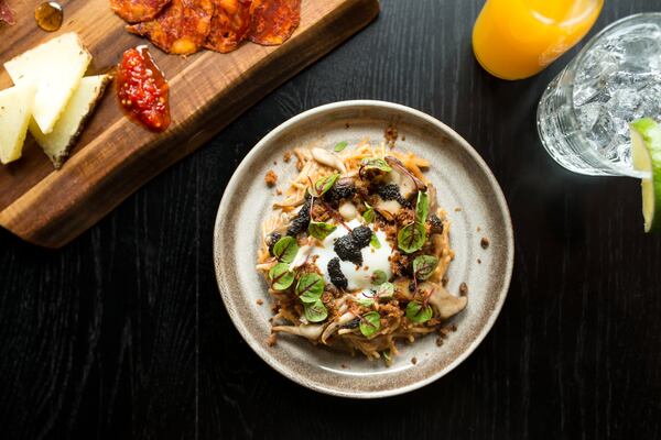 Fideos tapas, broken pasta with shiitake creme, wild mushrooms, poached egg, Iberico crumble, black truffle, and sorrel. Photo credit- Mia Yakel.