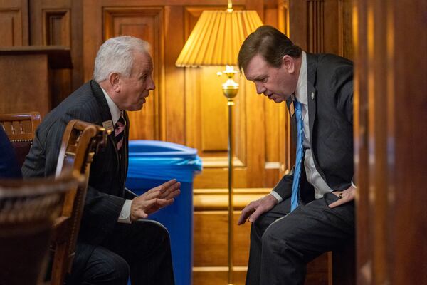 Left to right: Reps. Ron Stephens and Jesse Petrea, both Savannah Republicans, share a private moment at the Capitol.