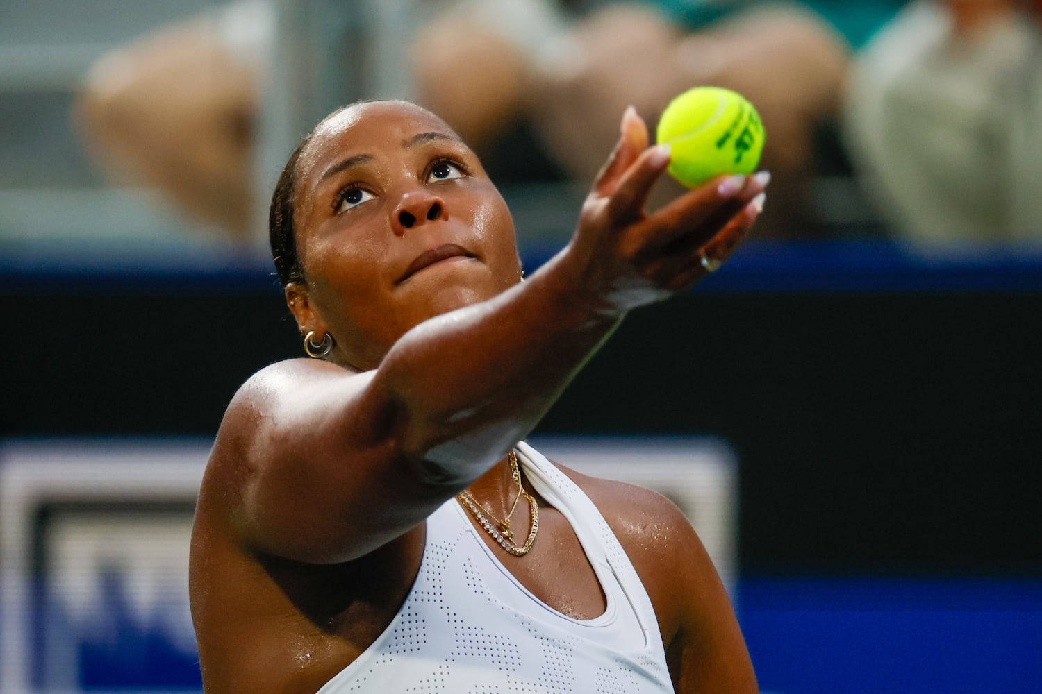 Taylor Townsend toses the ball for a serve against Sloane Stephens during an exhibition match in the  Atlanta Open at Atlantic Station on Sunday, July 21, 2024, in Atlanta,
(Miguel Martinez / AJC)