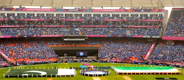 Large national flags of India and Pakistan are carried by children as the national anthems are played before the start of the ICC Men's Cricket World Cup match between India and Pakistan in Ahmedabad, India, Oct. 14, 2023. (AP Photo/Ajit Solanki, File)