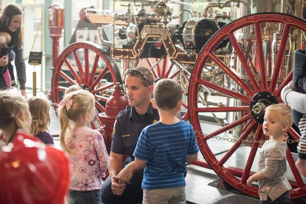 Nov. 17 is the deadline for those who may be selected to be interviewed for a Marietta Fire Department video for new firefighters — people who have been helped by Marietta EMTs. Here a Marietta firefighter guides a preschool tour of the Marietta Fire Museum, which is undergoing renovation. Courtesy of Marietta