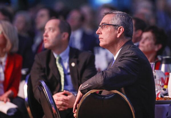 Secretary of State Brad Raffensperger listens to speakers at the annual Georgia Chamber of Commerce - Eggs & Issues Breakfast. Many networking events have been canceled and replaced with virtual events because of the coronavirus pandemic. Bob Andres / bandres@ajc.com AJC FILE PHOTO