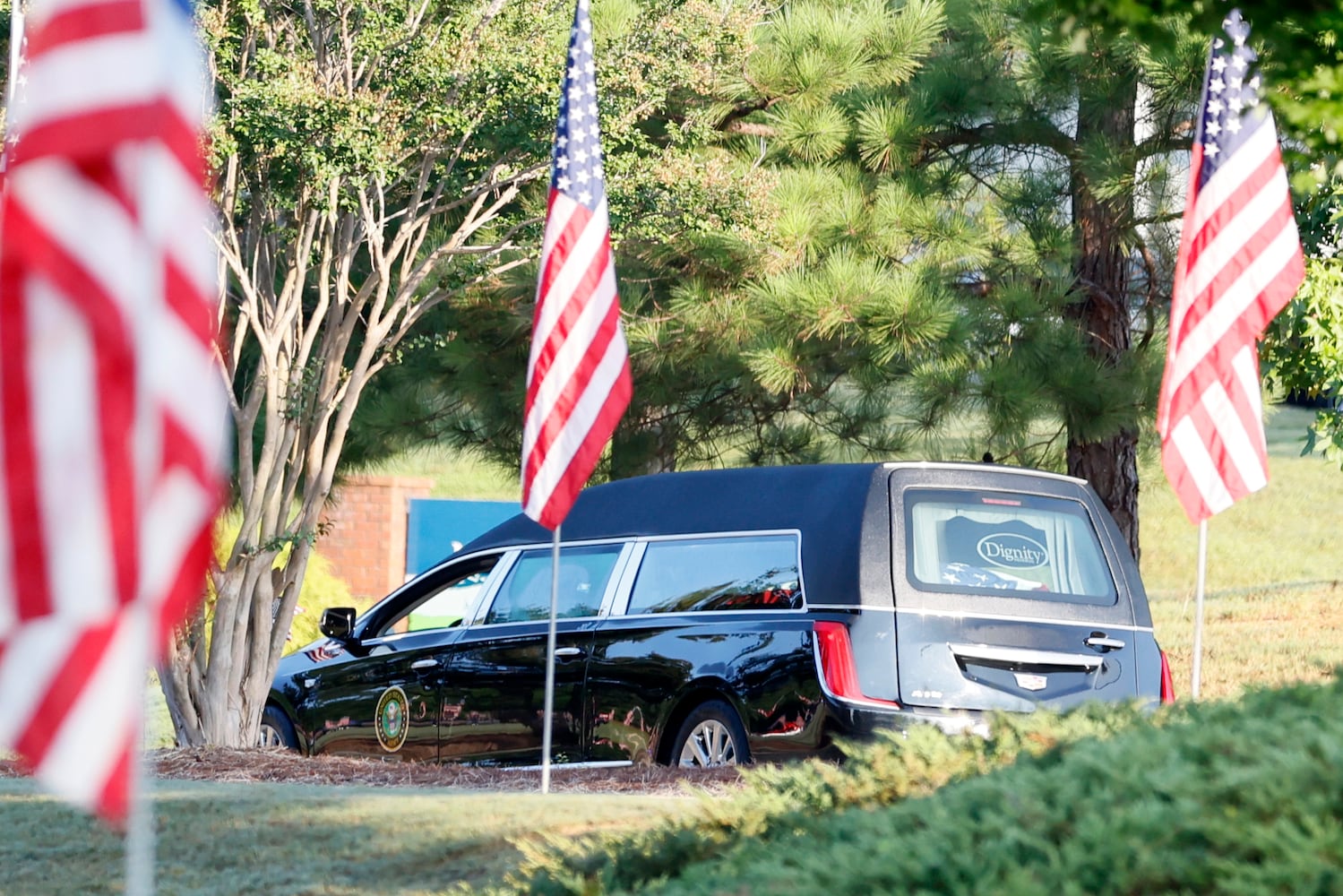 The hearse of Deputy Jonathan Koleski arrives at the NorthStar Church for his funeral service on Wednesday, September 14, 2022. Deputy Koleski, alongside Marshall Samual Ervin Jr, was killed late Thursday while attempting to arrest Christopher James Cook Jr. at home in the Hampton Glen subdivision last Thursday. Miguel Martinez / miguel.martinezjimenez@ajc.com