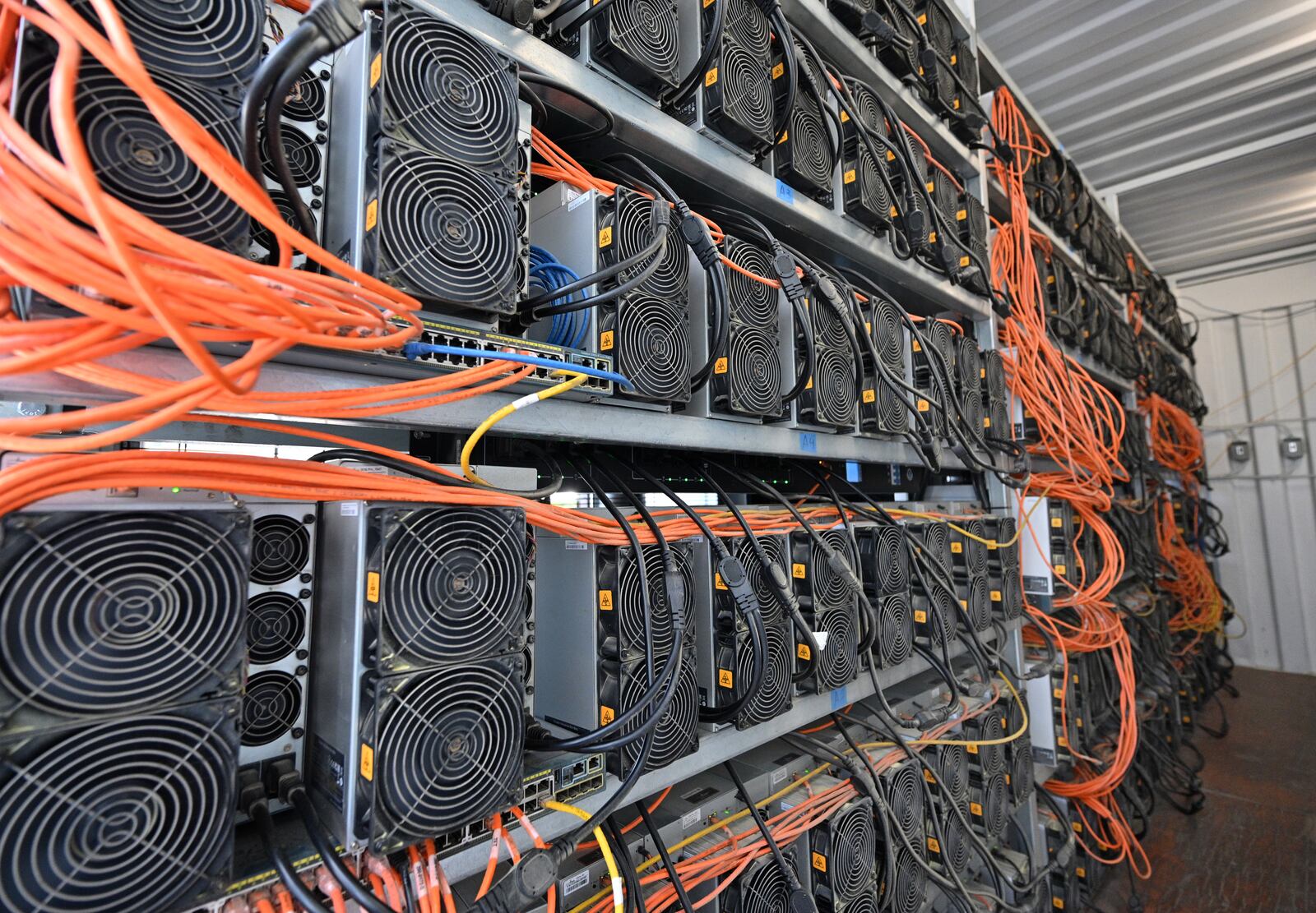 Thousands of computers are packed inside a bitcoin mining facility at Cleanspark in College Park. Georgia has become a destination for such facilities. (Hyosub Shin / Hyosub.Shin@ajc.com)