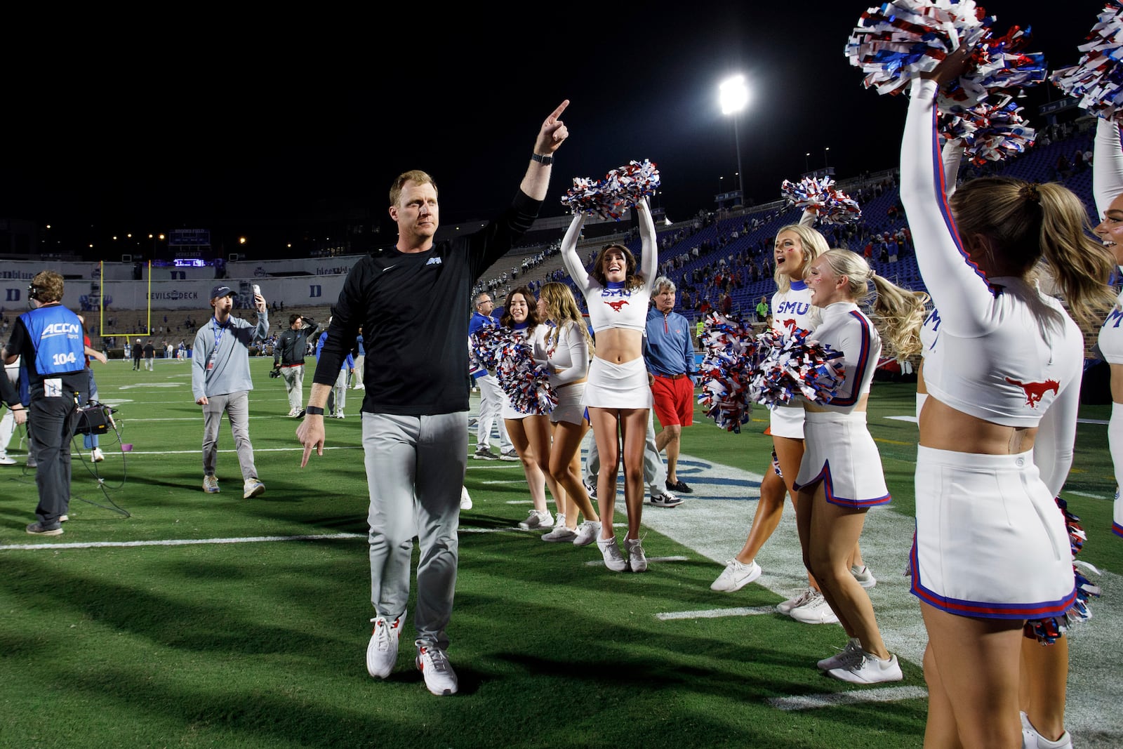 SMU head coach Rhett Lashlee points to fans after defeating Duke in an NCAA college football game in Durham, N.C., Saturday, Oct. 26, 2024. (AP Photo/Ben McKeown)