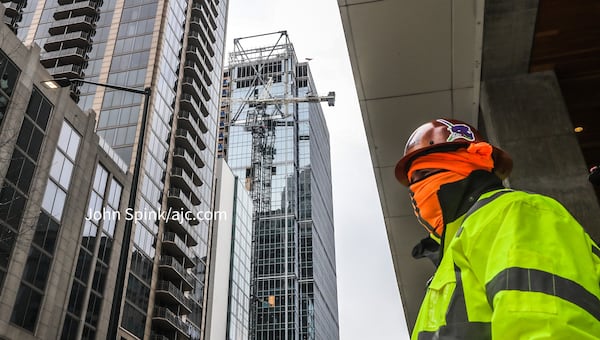 A portion of West Peachtree Street is shut down in Midtown as crews work to stabilize the crane.