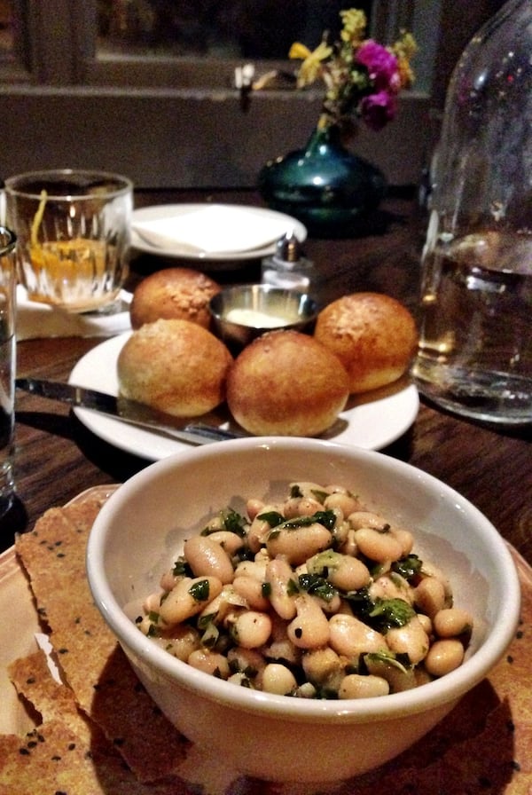 A bowl of herb-marinated white beans is perfect for passing around the table at Poor Hendrix. CONTRIBUTED BY WYATT WILLIAMS